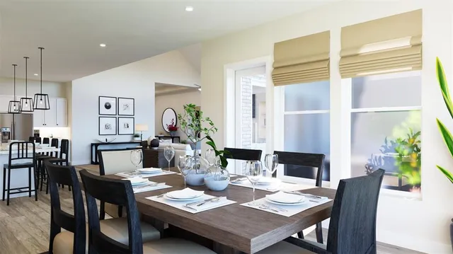 a dining room with furniture and wooden floor