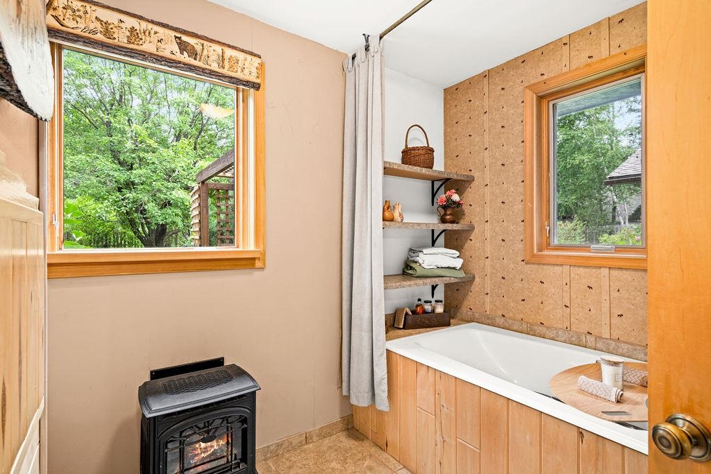 8639 South Strand Lake Road Cotton, MN 55724 - Photo 16 of 50 Gas Stove, Soaking Tub, what a dreamy bathroom