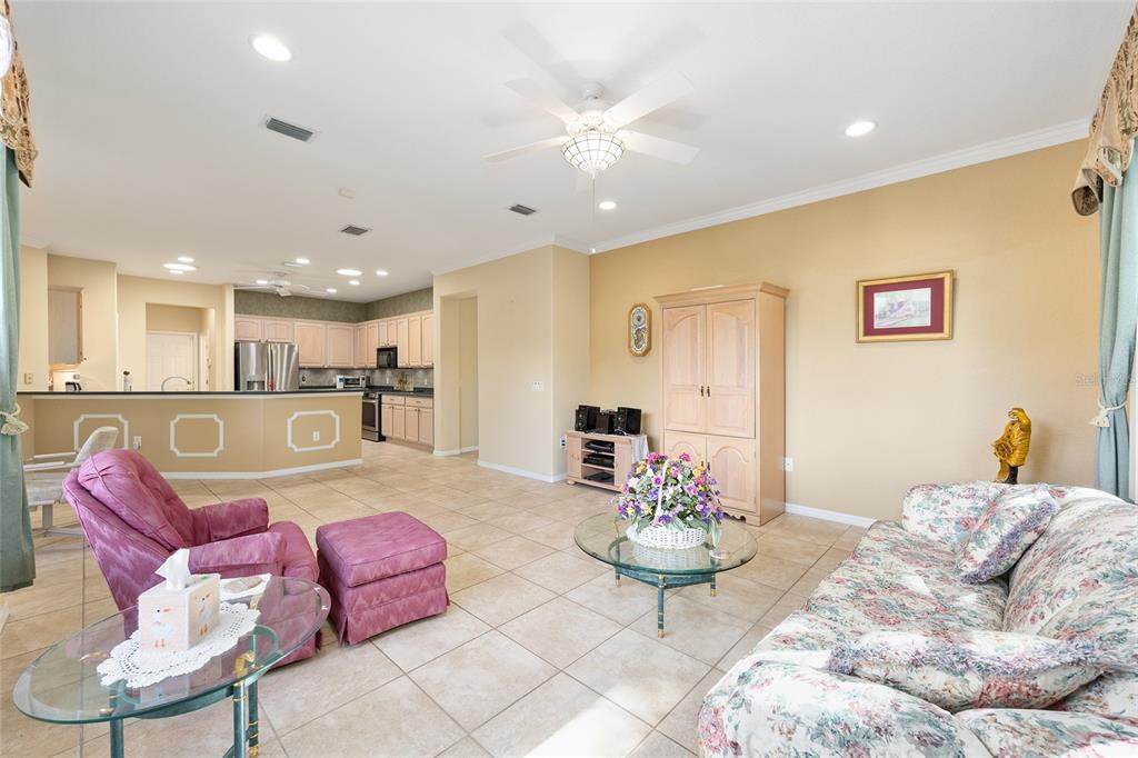 9019 Southeast 120th Loop Summerfield, FL 34491 - Photo 15 of 69 a living room with furniture and kitchen view