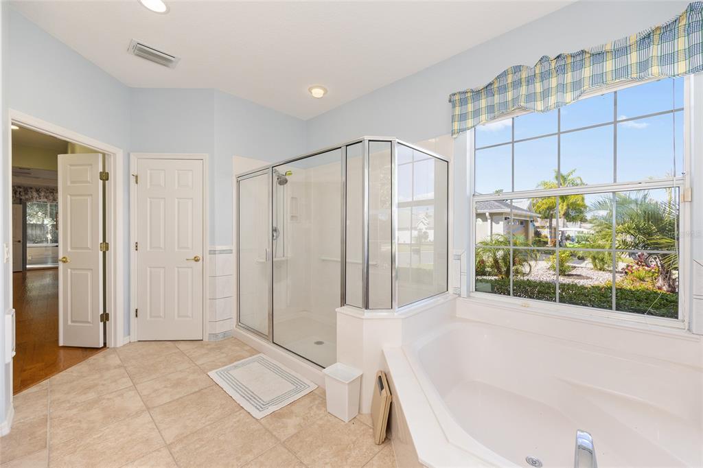 9019 Southeast 120th Loop Summerfield, FL 34491 - Photo 21 of 69 a bathroom with a tub and shower
