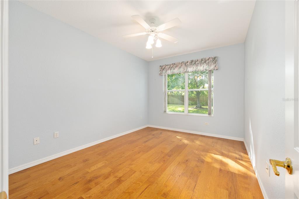 9019 Southeast 120th Loop Summerfield, FL 34491 - Photo 23 of 69 a view of a big room with windows and chandelier fan