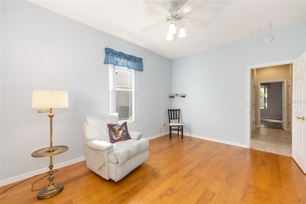 9019 Southeast 120th Loop Summerfield, FL 34491 - Photo 25 of 69 a living room with furniture and a table
