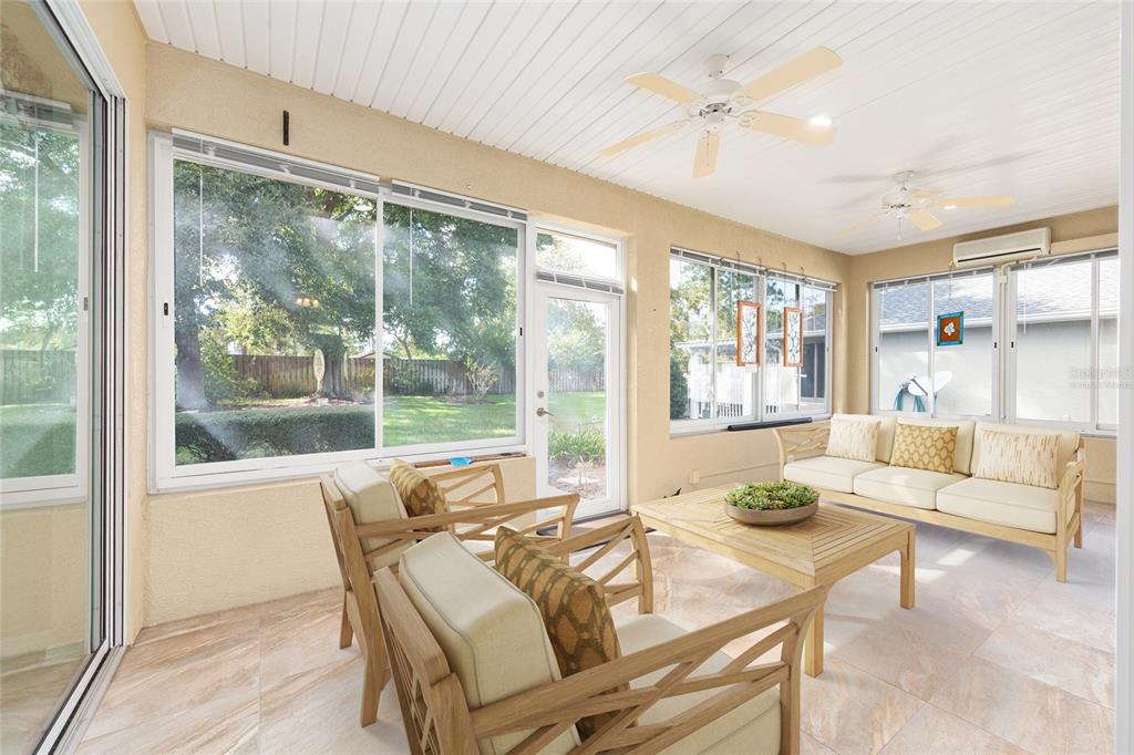 9019 Southeast 120th Loop Summerfield, FL 34491 - Photo 28 of 69 a living room with furniture and a large window