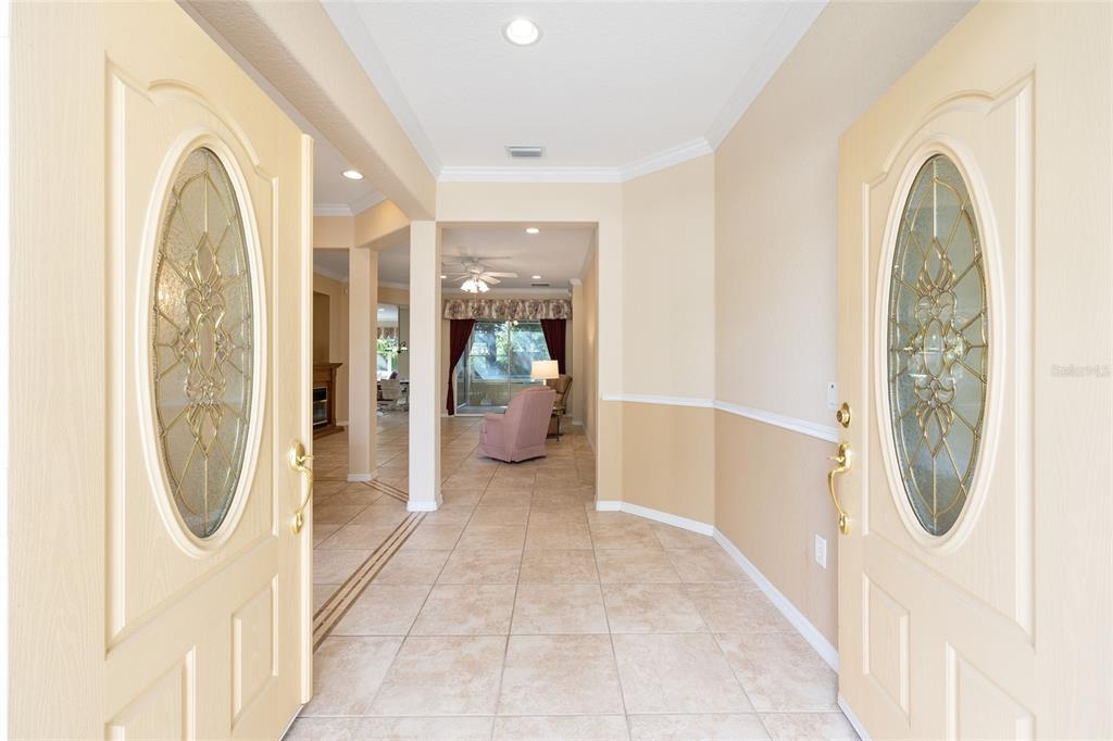 9019 Southeast 120th Loop Summerfield, FL 34491 - Photo 4 of 69 a view of a hallway with furniture and a mirror