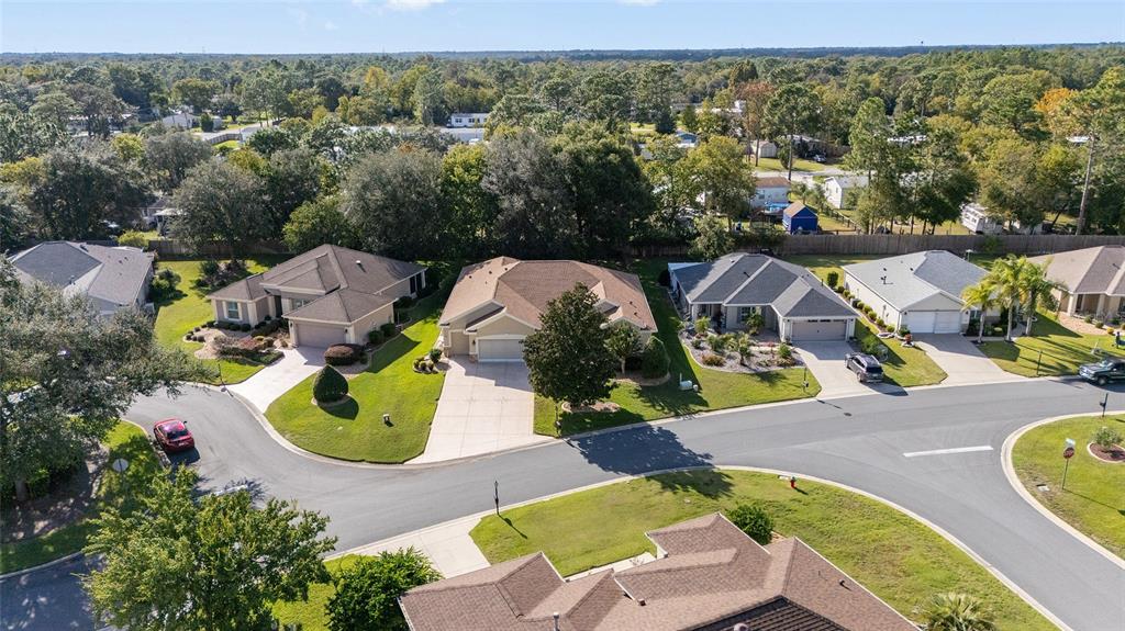 9019 Southeast 120th Loop Summerfield, FL 34491 - Photo 43 of 69 an aerial view of a house with a swimming pool