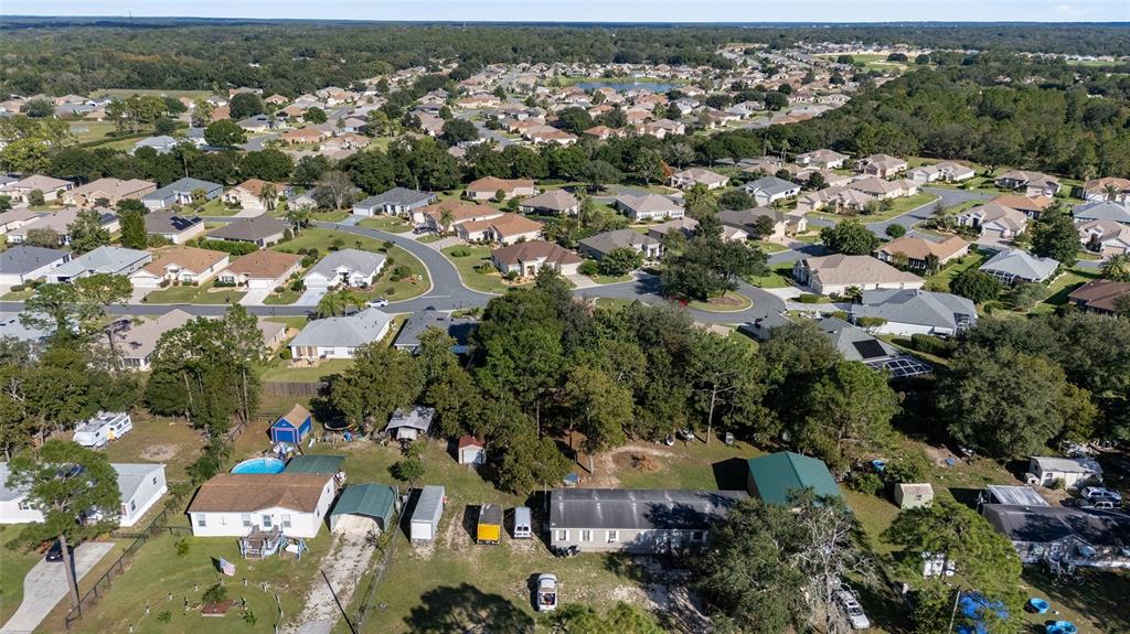 9019 Southeast 120th Loop Summerfield, FL 34491 - Photo 49 of 69 an aerial view of a city with lots of residential buildings