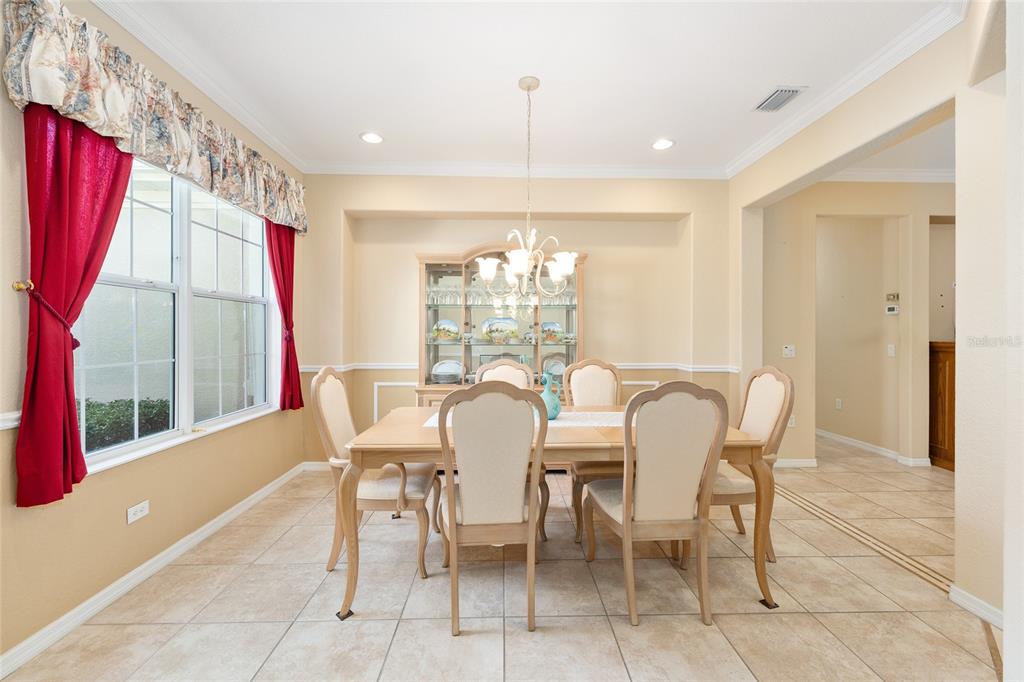 9019 Southeast 120th Loop Summerfield, FL 34491 - Photo 6 of 69 a dining room with furniture and a window