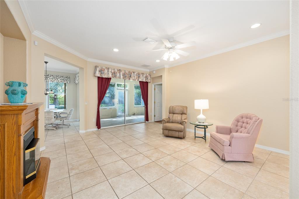 9019 Southeast 120th Loop Summerfield, FL 34491 - Photo 9 of 69 a living room with furniture and a flat screen tv