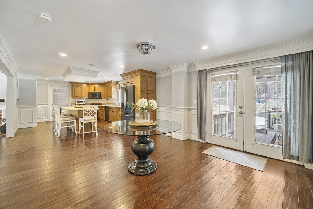390 Cooper Road Northbridge, MA 01534 - Photo 12 of 34 a kitchen with stainless steel appliances refrigerator dining table and chairs