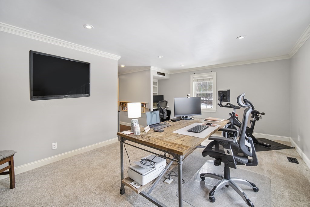 390 Cooper Road Northbridge, MA 01534 - Photo 14 of 34 a view of a dining room with furniture and a flat screen tv