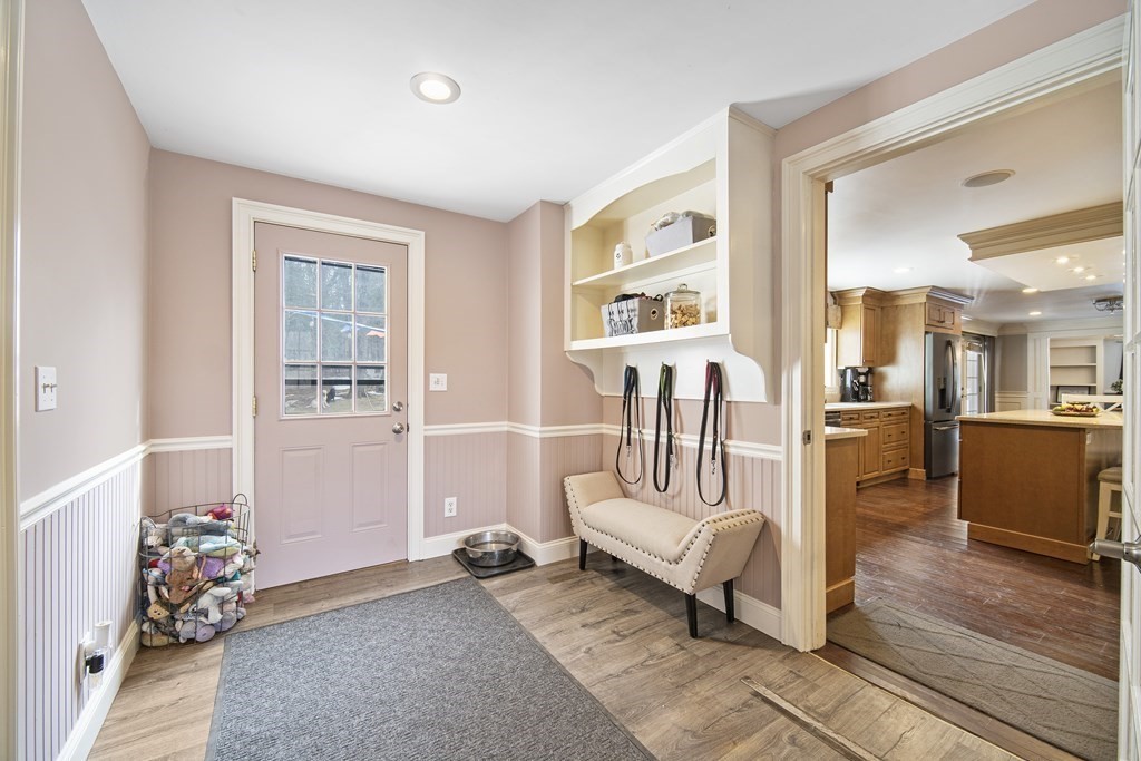 390 Cooper Road Northbridge, MA 01534 - Photo 15 of 34 a living room with furniture and a wooden floor
