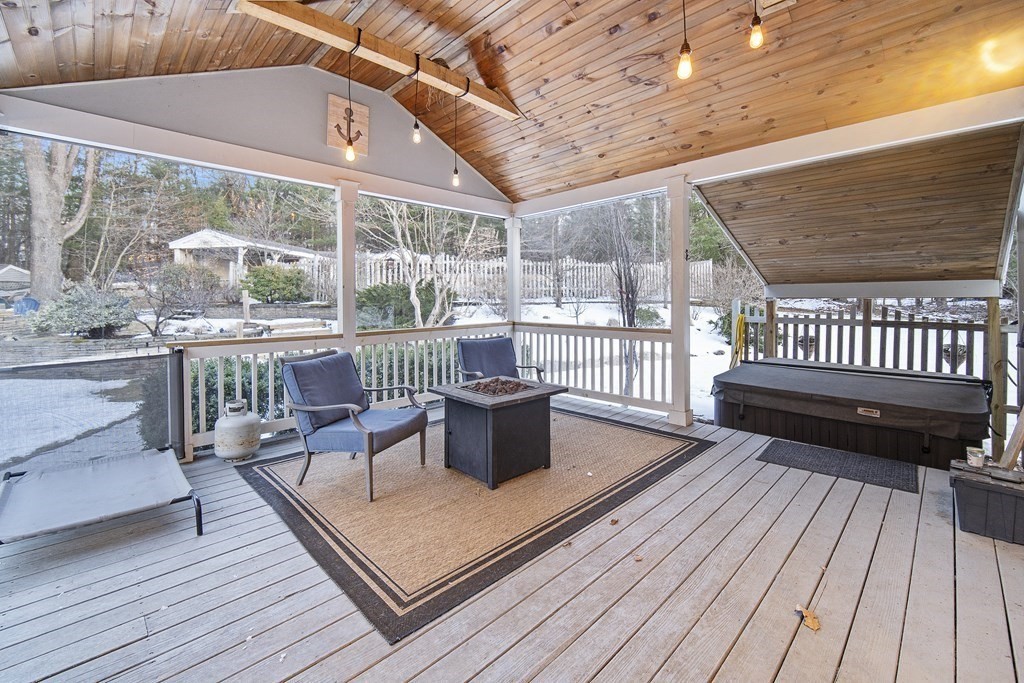 390 Cooper Road Northbridge, MA 01534 - Photo 17 of 34 a view of a roof deck with wooden floor and outdoor seating