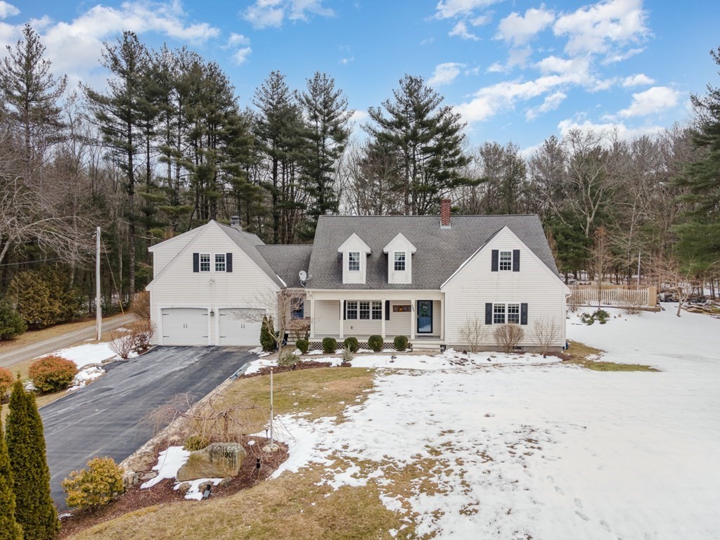 390 Cooper Road Northbridge, MA 01534 - Photo 2 of 34 a view of a white house with a yard covered in snow
