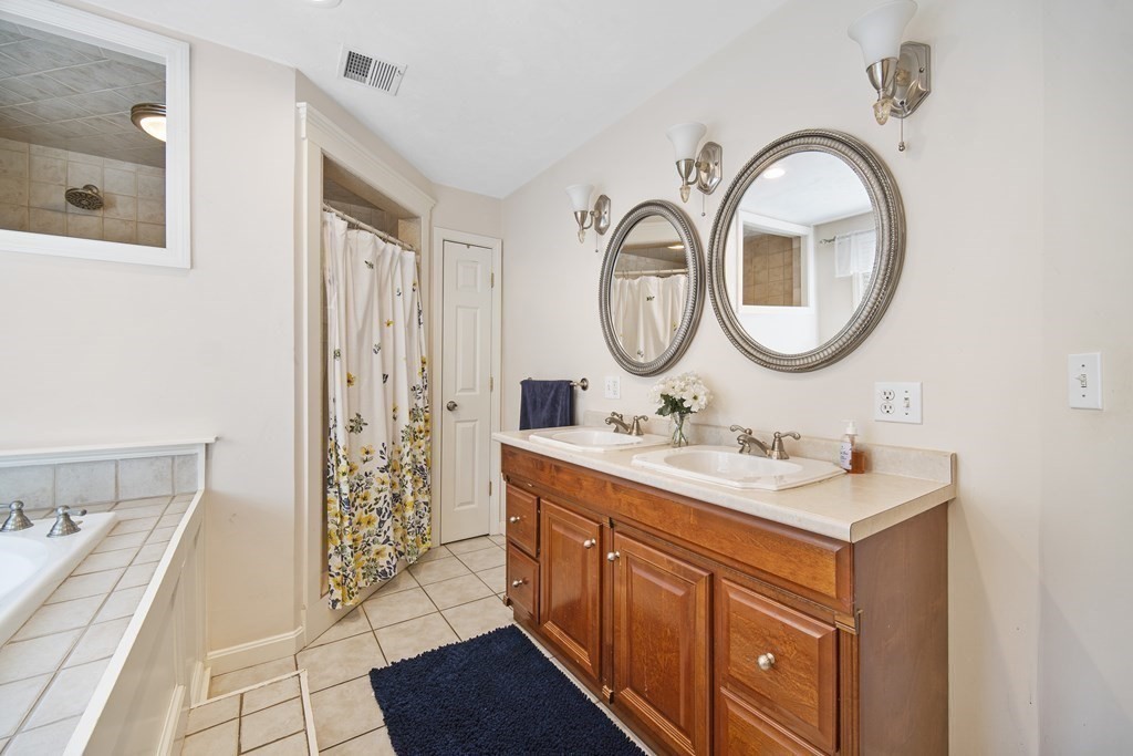 390 Cooper Road Northbridge, MA 01534 - Photo 22 of 34 a bathroom with a granite countertop sink and a mirror