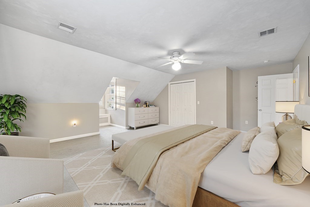 390 Cooper Road Northbridge, MA 01534 - Photo 24 of 34 a bedroom with a bed and a chandelier