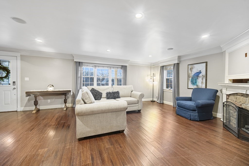390 Cooper Road Northbridge, MA 01534 - Photo 6 of 34 a living room with furniture and a wooden floor