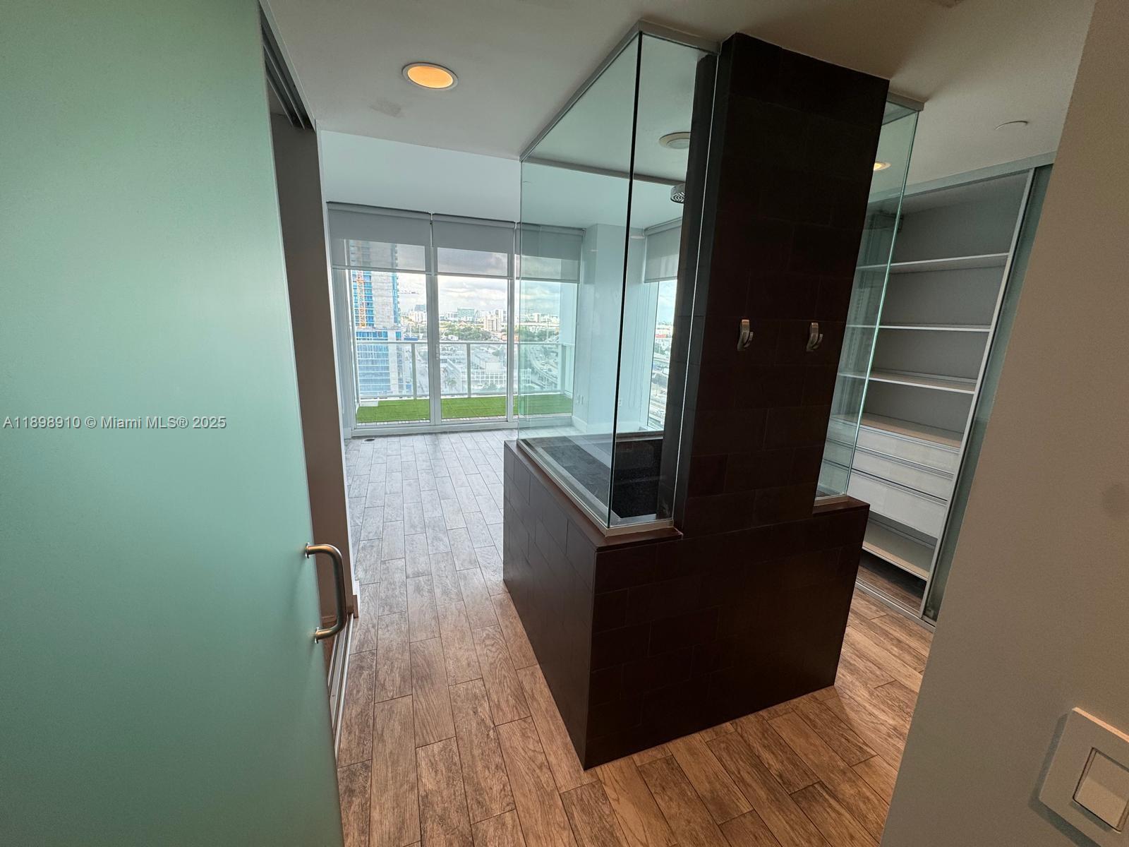 1040 Biscayne Boulevard, Unit 1106 Miami, FL 33132 - Photo 15 of 29 a living room with furniture and a fireplace