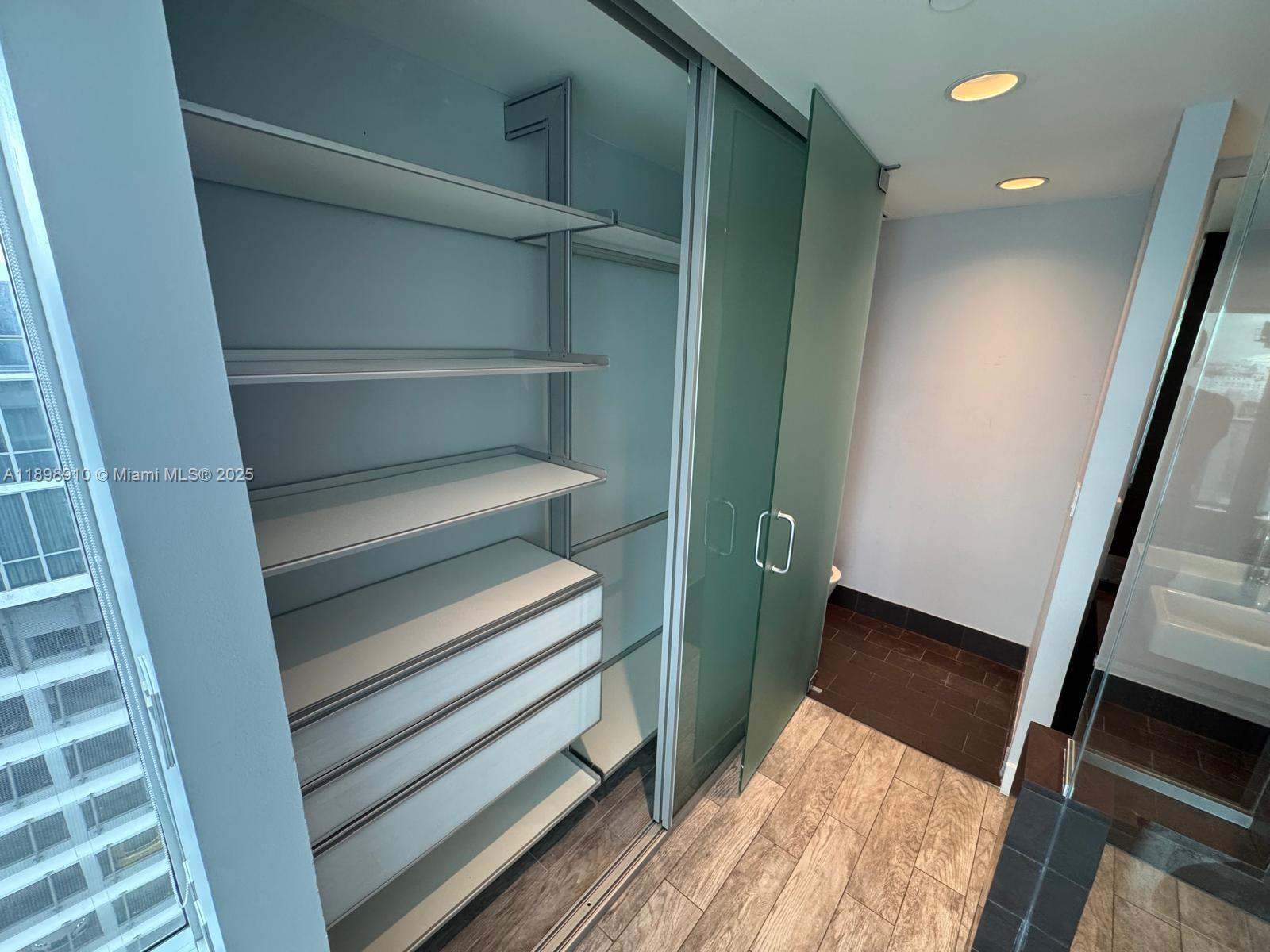 1040 Biscayne Boulevard, Unit 1106 Miami, FL 33132 - Photo 20 of 29 a view of walk in closet
