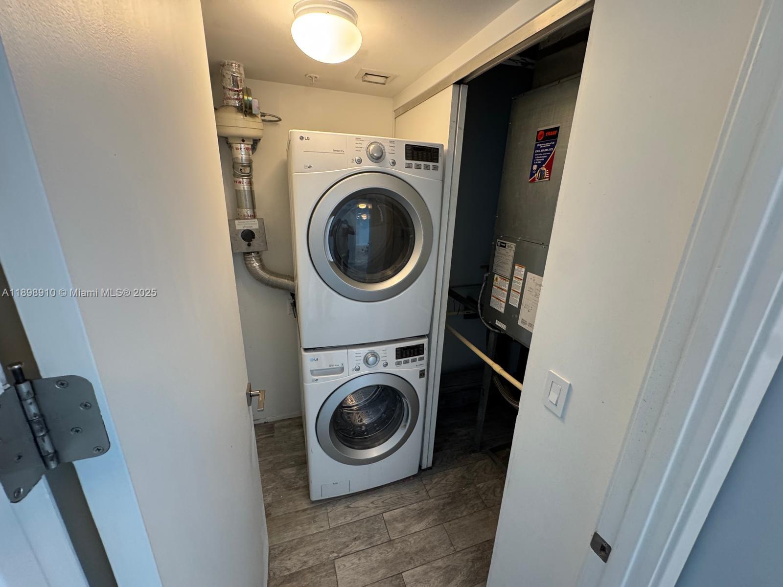 1040 Biscayne Boulevard, Unit 1106 Miami, FL 33132 - Photo 26 of 29 a utility room with dryer and washer