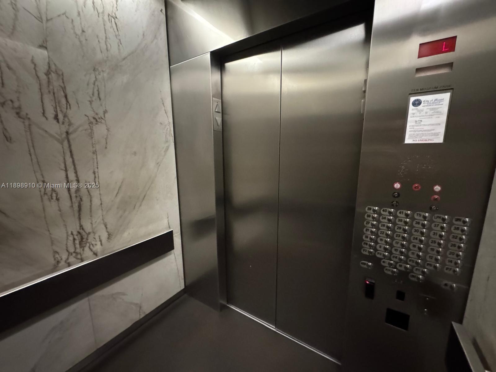 1040 Biscayne Boulevard, Unit 1106 Miami, FL 33132 - Photo 4 of 29 a bathroom with a shower and a sink