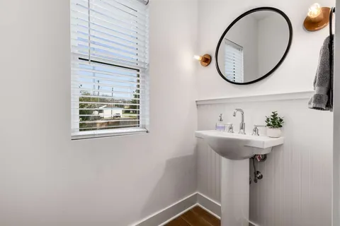 a bathroom with a sink and mirror