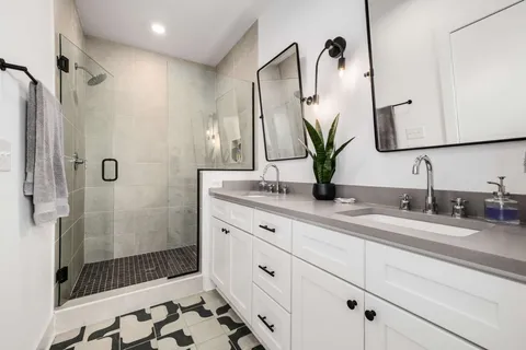 a bathroom with double vanity sink