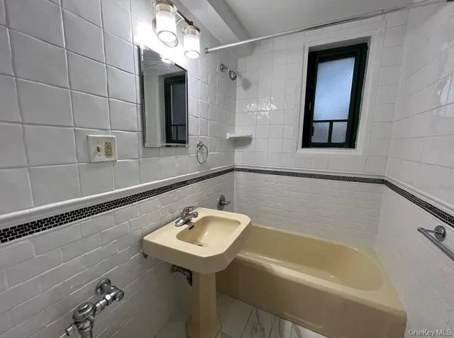 a bathroom with a sink and a bathtub