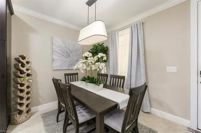 a view of a dining room with furniture window and entryway