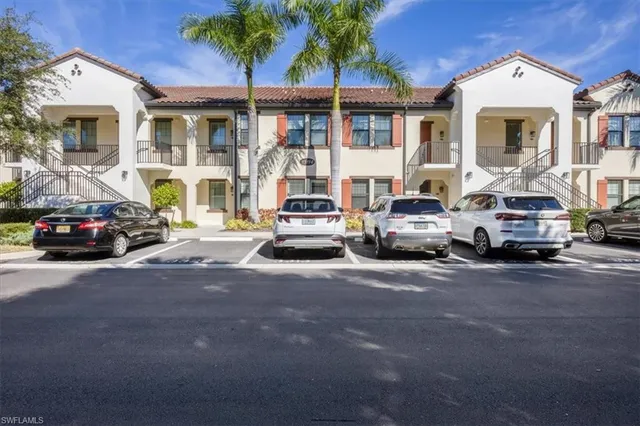 a view of a cars parked in front of a house