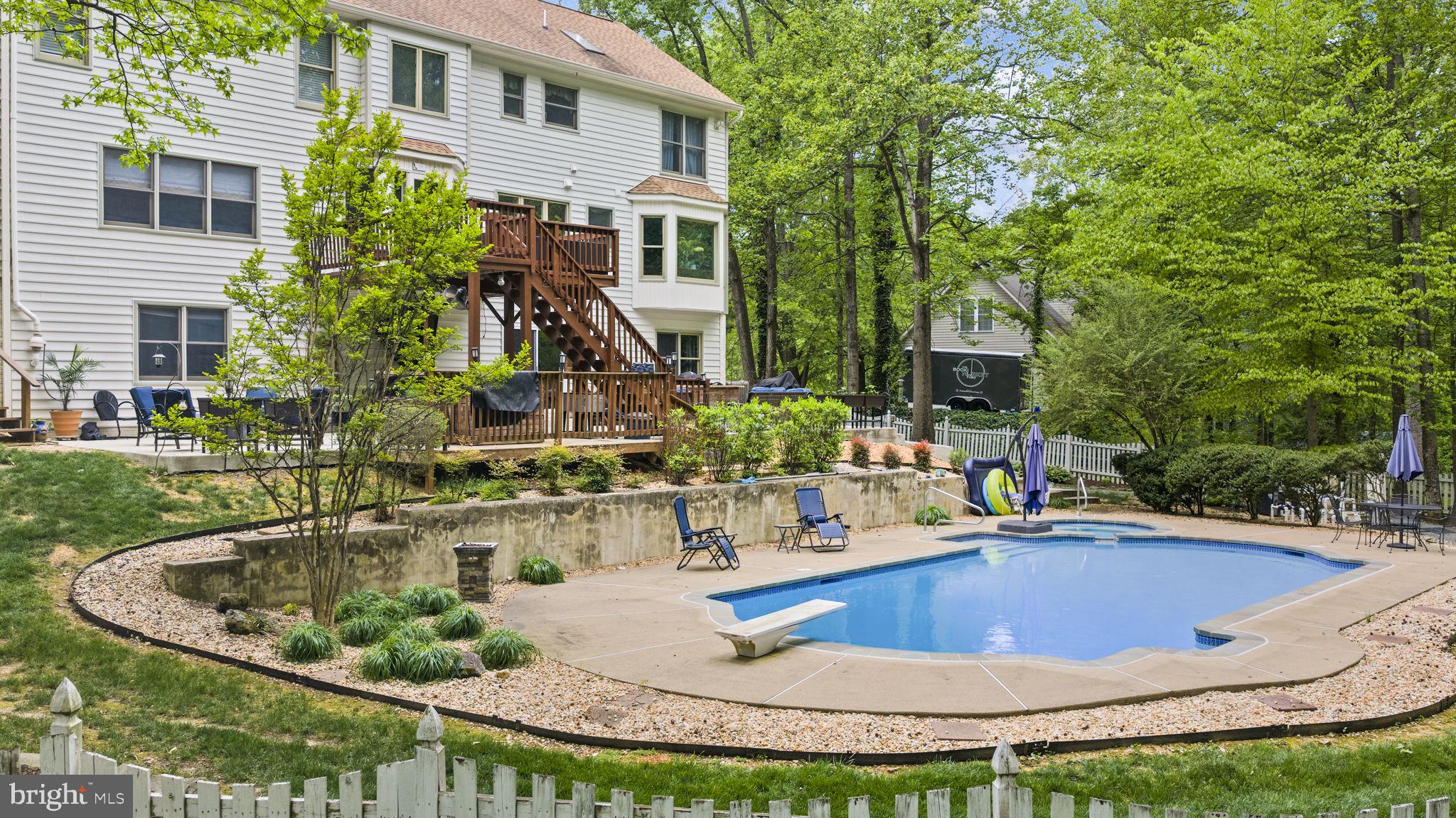 100 Boscobel Road Fredericksburg, VA 22405 - Photo 62 of 67 a view of a house with swimming pool and sitting area