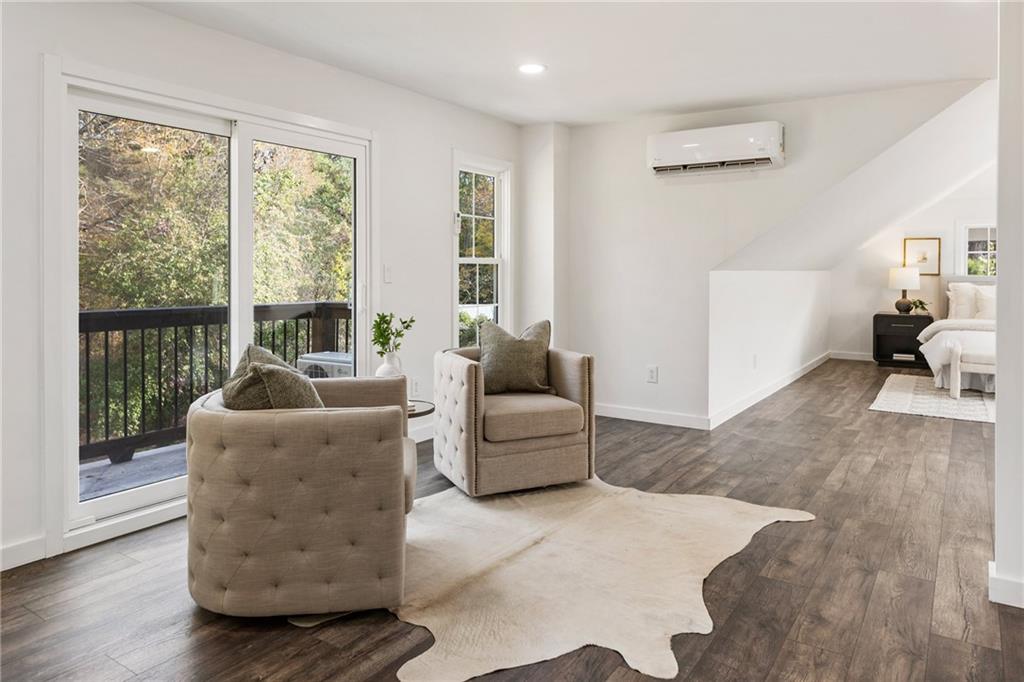 14440 Cogburn Road Alpharetta, GA 30004 - Photo 30 of 62 a living room with furniture and a large window
