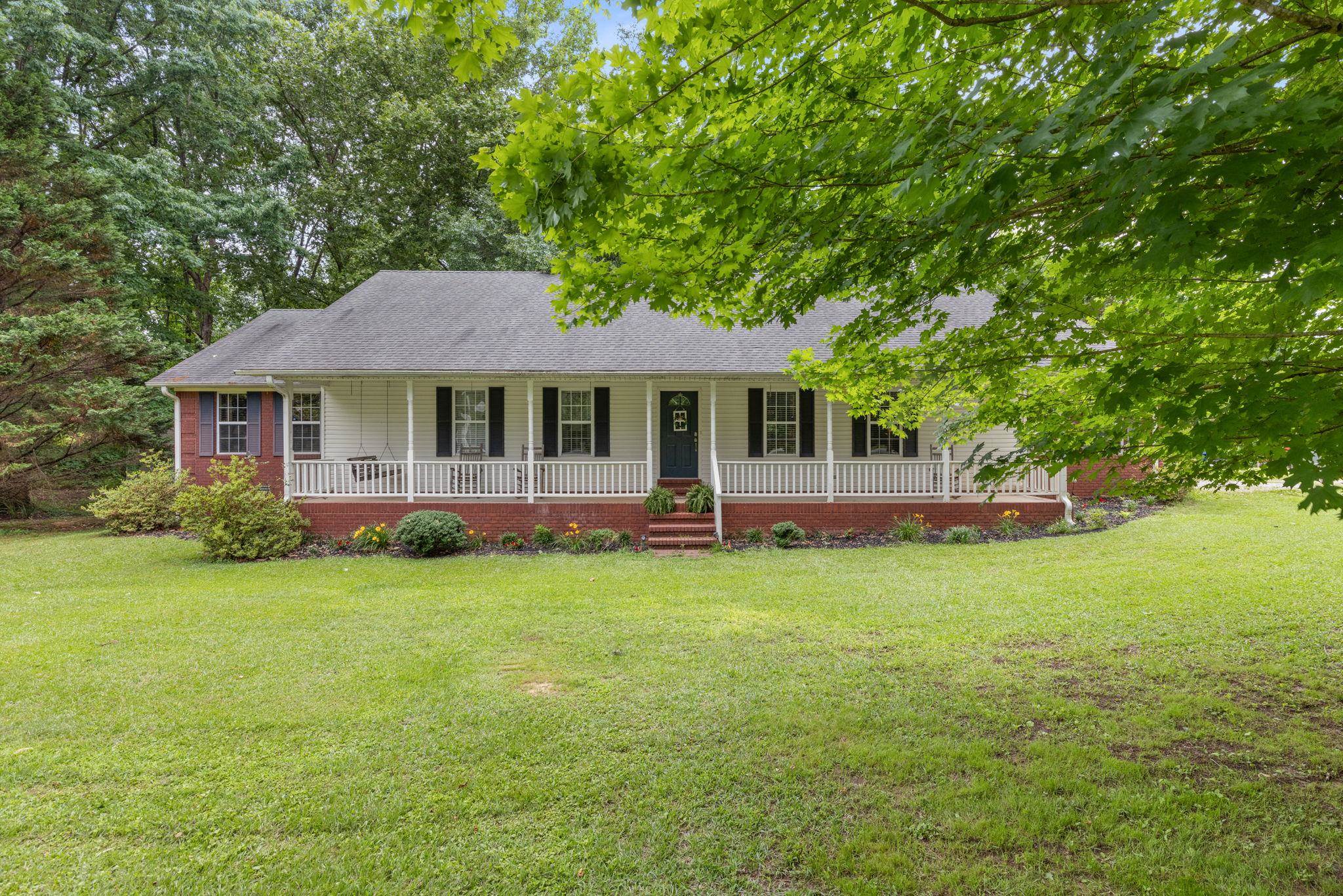 4625 Tucker Road Golden, MS 38847 - Photo 1 of 35 a front view of a house with a garden