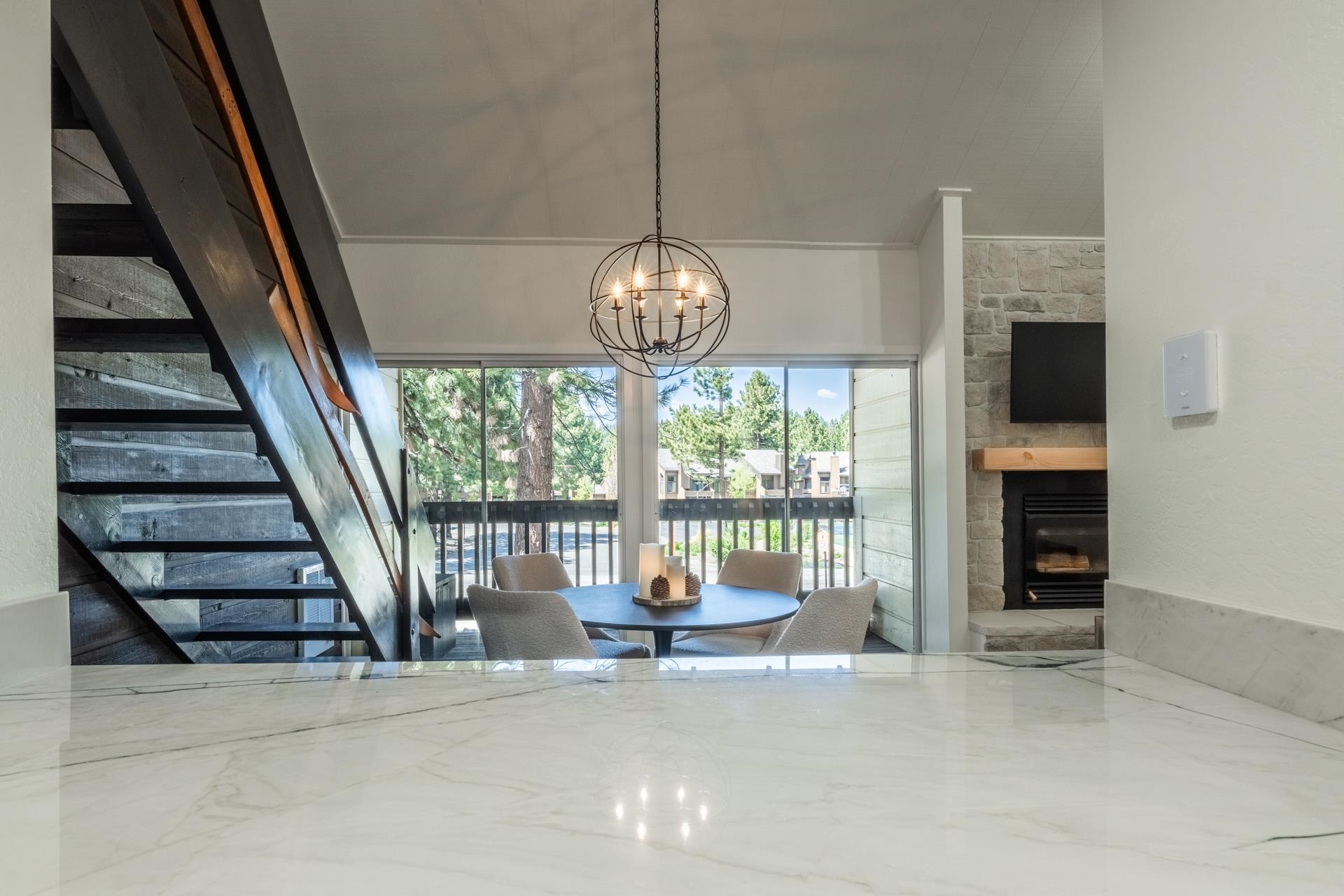 2289 Sierra Nevada Road, Unit F15 Mammoth Lakes, CA 93546 - Photo 15 of 44 a living room with fireplace furniture a flat screen tv and a large window