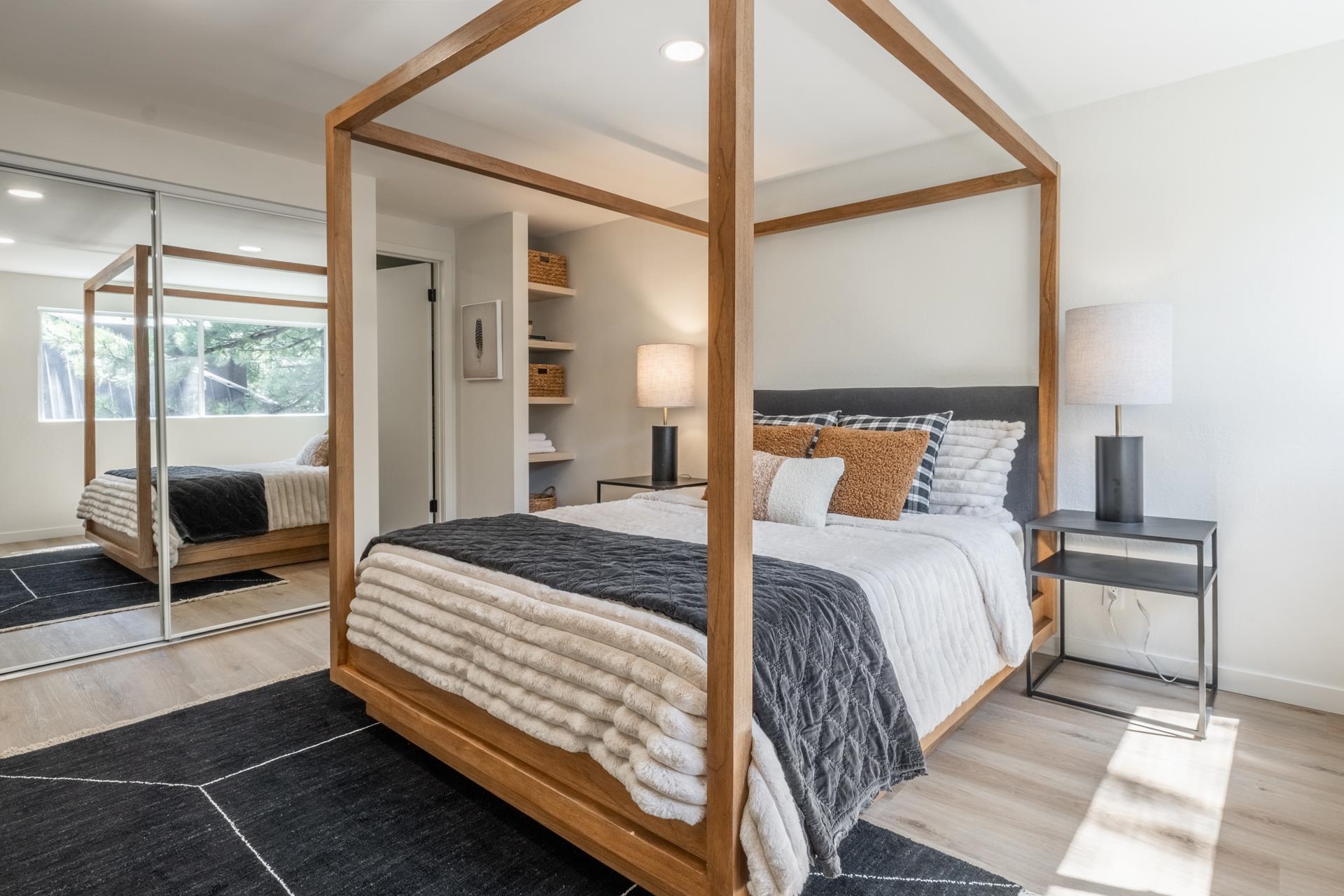 2289 Sierra Nevada Road, Unit F15 Mammoth Lakes, CA 93546 - Photo 28 of 44 a bedroom with a bed and a mirror