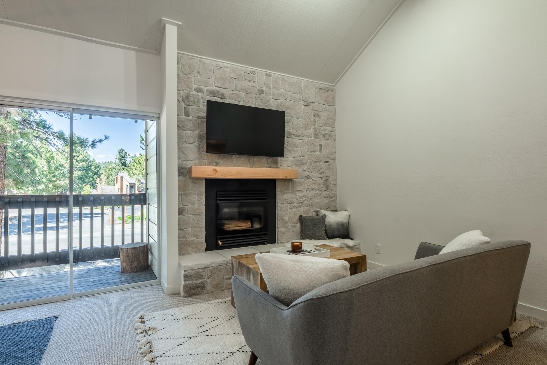 2289 Sierra Nevada Road, Unit F15 Mammoth Lakes, CA 93546 - Photo 3 of 44 a living room with furniture and a fireplace