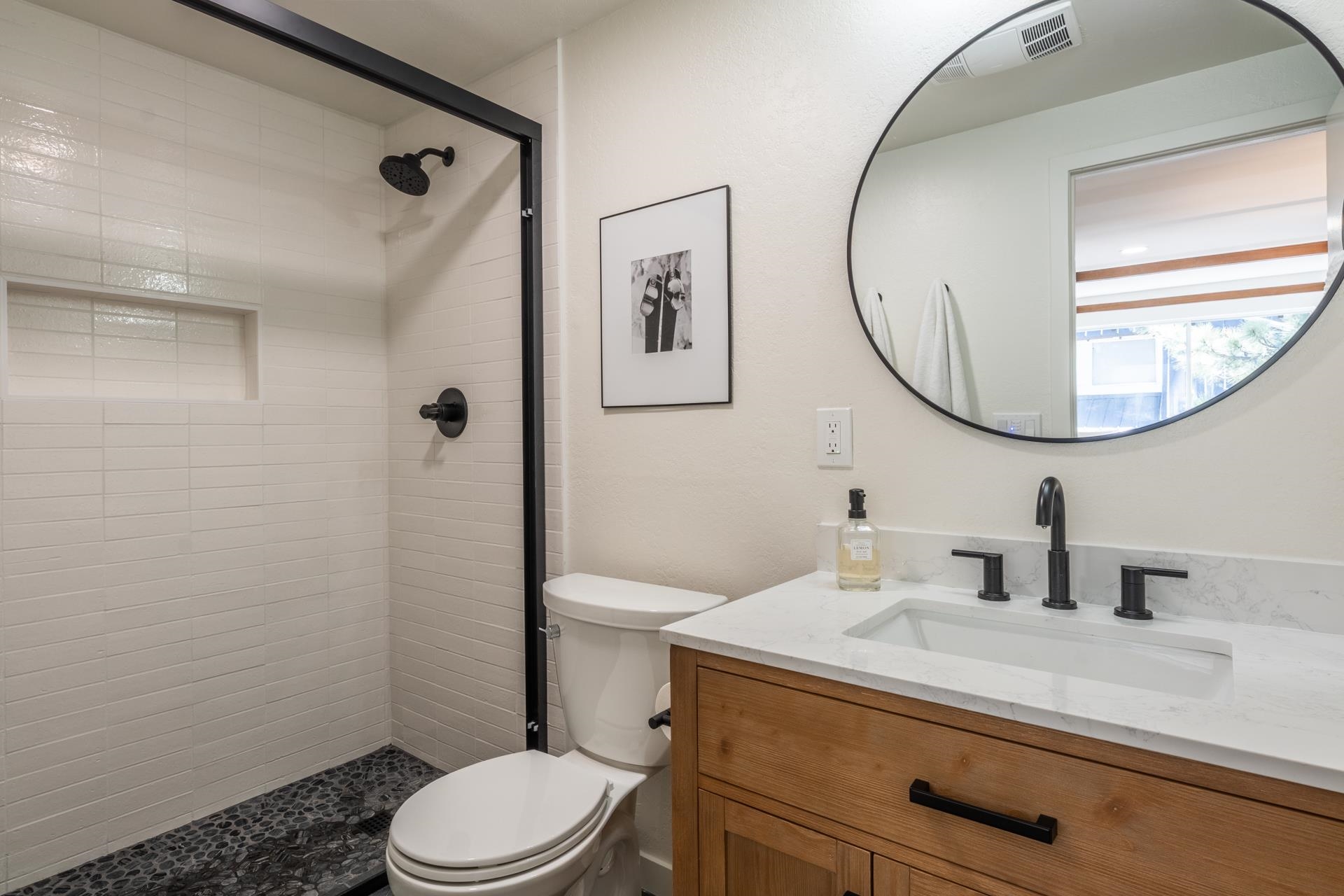 2289 Sierra Nevada Road, Unit F15 Mammoth Lakes, CA 93546 - Photo 32 of 44 a bathroom with a toilet a sink and mirror