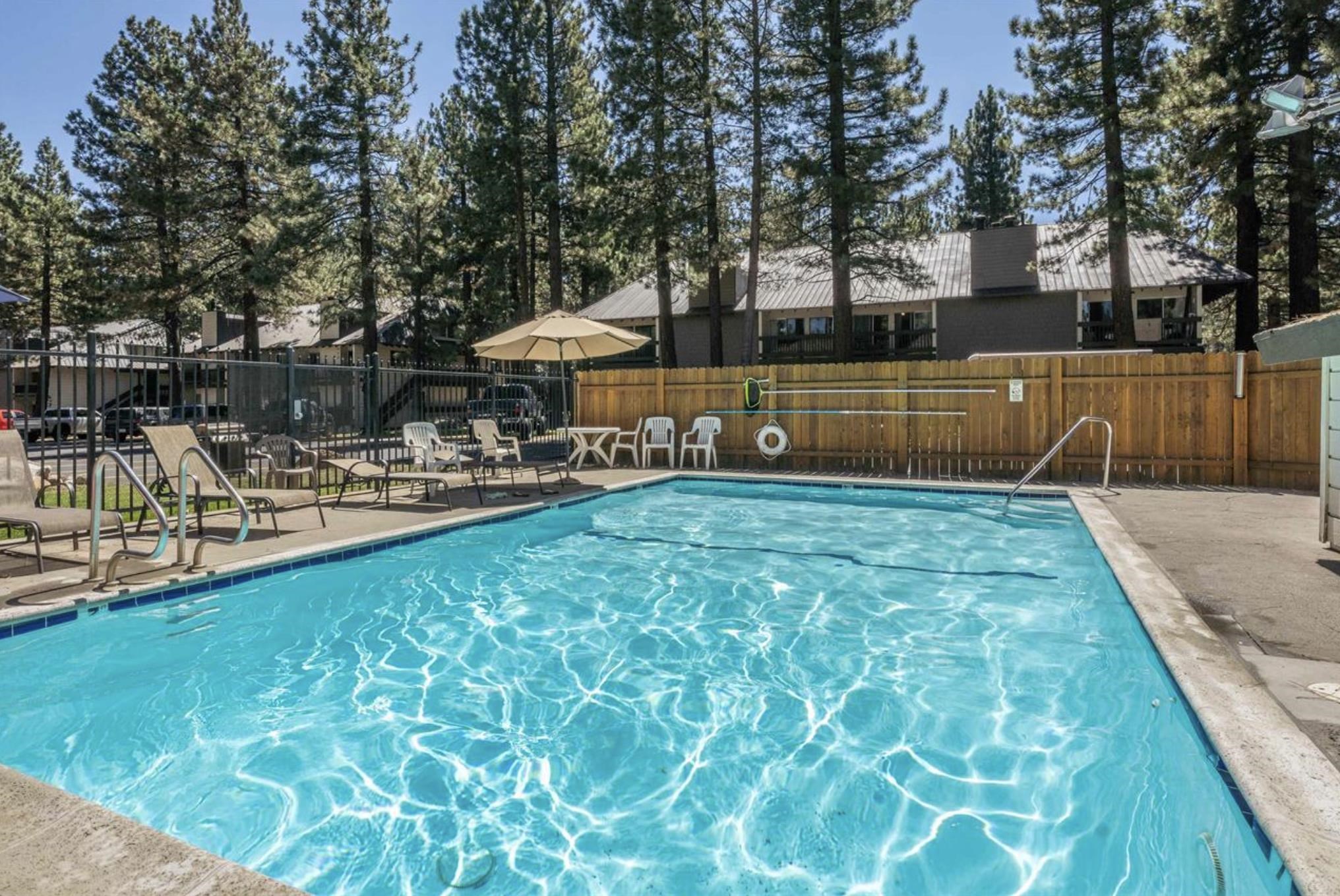 2289 Sierra Nevada Road, Unit F15 Mammoth Lakes, CA 93546 - Photo 42 of 44 a swimming pool with outdoor seating and yard