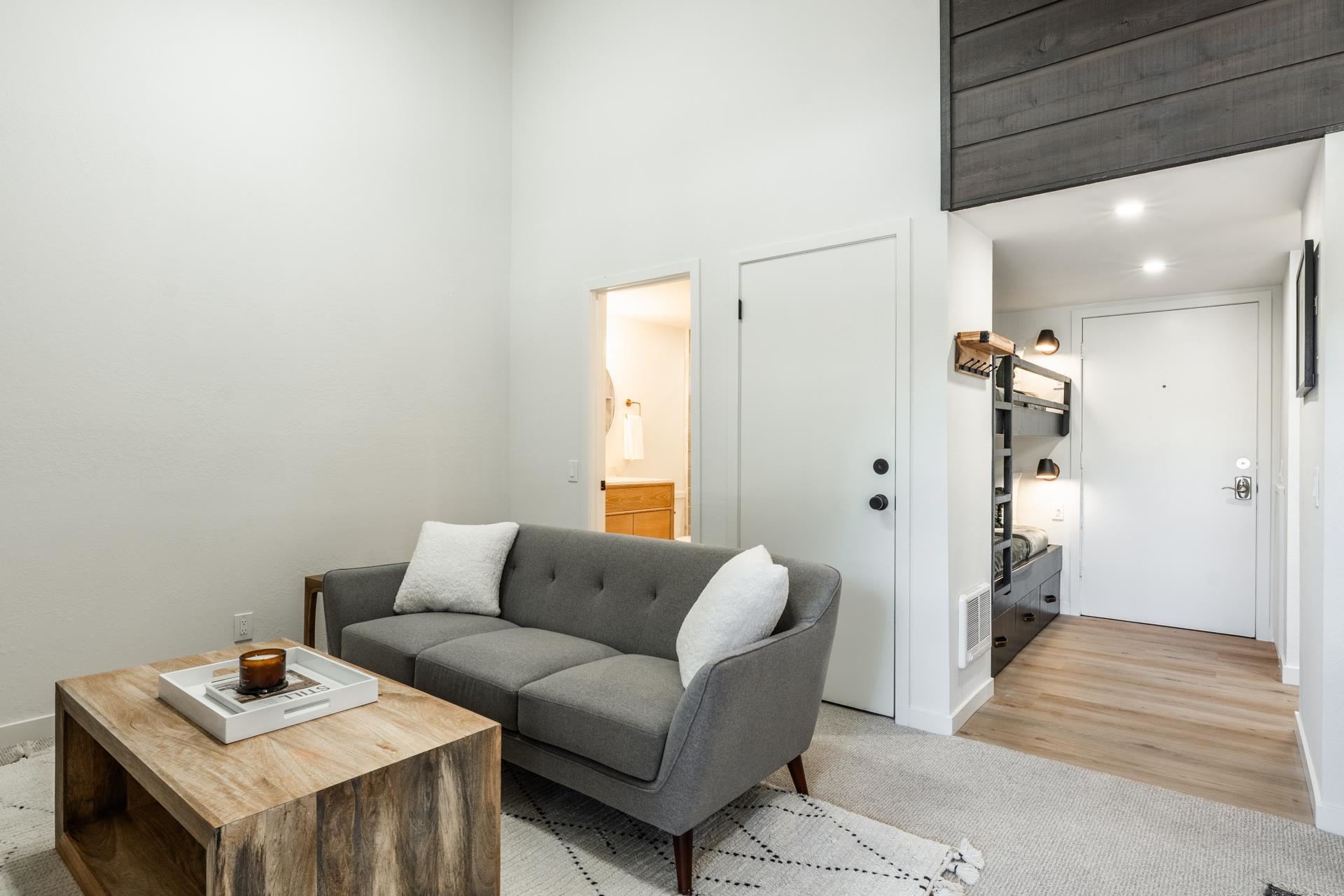 2289 Sierra Nevada Road, Unit F15 Mammoth Lakes, CA 93546 - Photo 7 of 44 a living room with furniture and a wooden floor