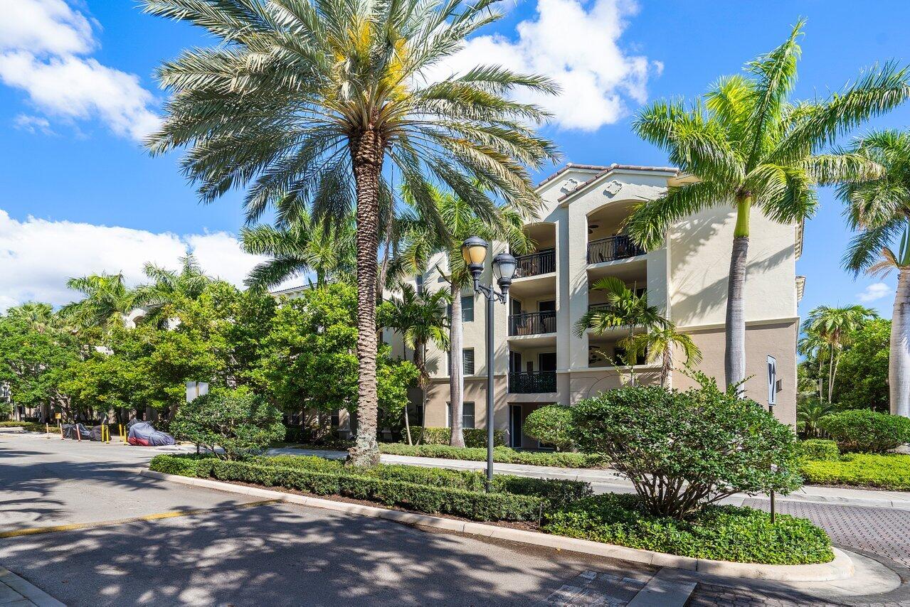 1 Renaissance Way, Unit 416 Boynton Beach, FL 33426 - Photo 1 of 31 a view of a palm trees in a yard with a house