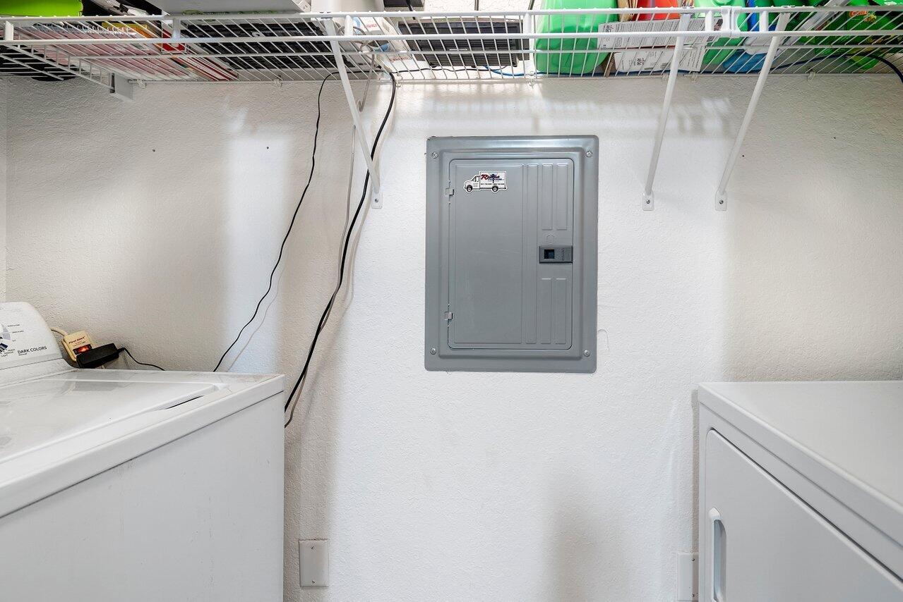 1 Renaissance Way, Unit 416 Boynton Beach, FL 33426 - Photo 11 of 31 a utility room with a washer and dryer