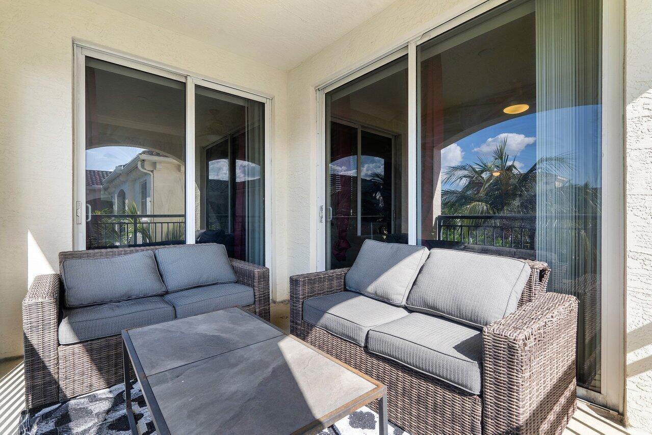 1 Renaissance Way, Unit 416 Boynton Beach, FL 33426 - Photo 13 of 31 a living room with furniture and a floor to ceiling window