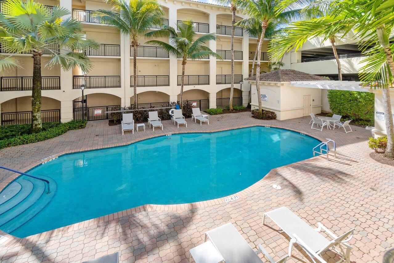 1 Renaissance Way, Unit 416 Boynton Beach, FL 33426 - Photo 16 of 31 a view of a backyard with swimming pool
