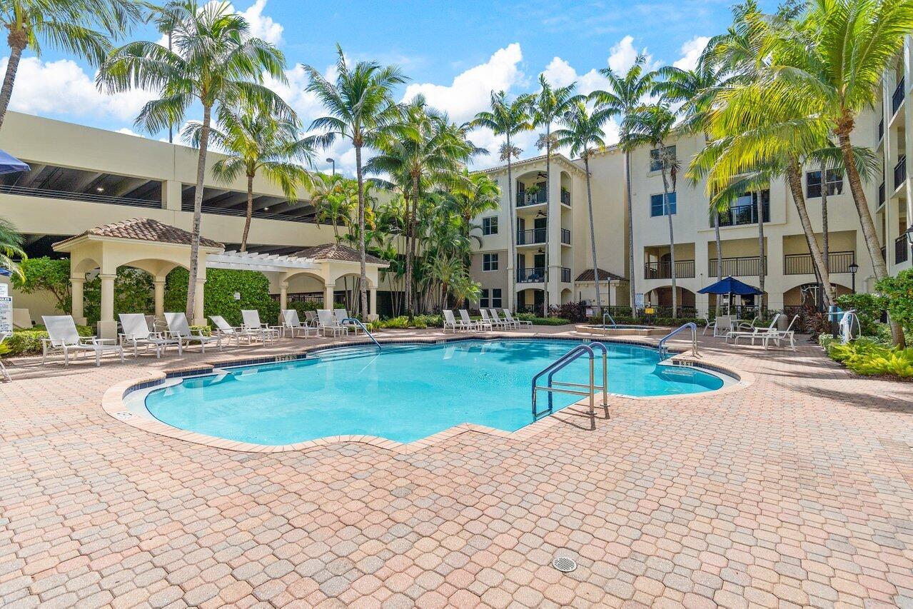 1 Renaissance Way, Unit 416 Boynton Beach, FL 33426 - Photo 18 of 31 a swimming pool with outdoor seating and yard