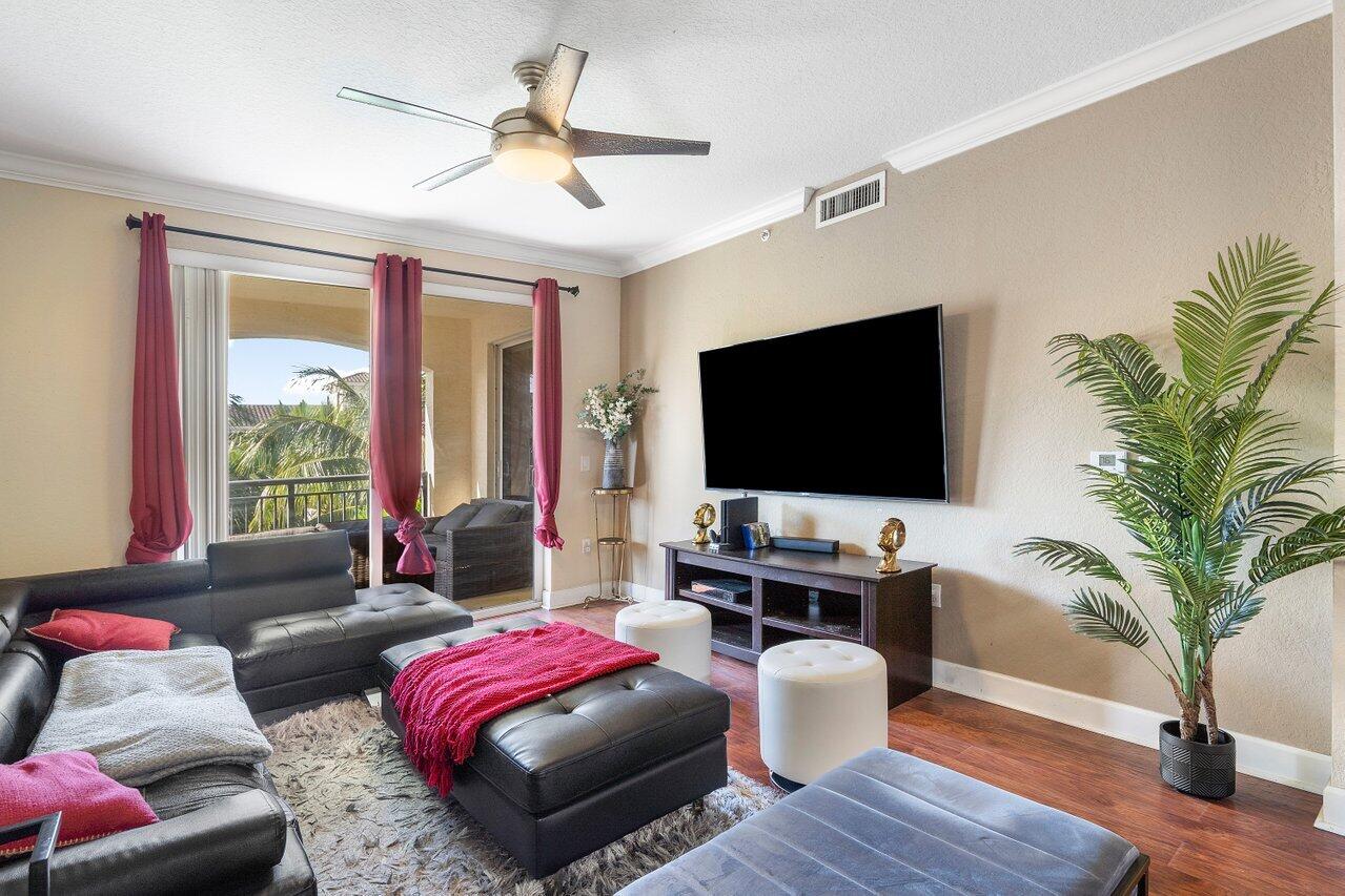 1 Renaissance Way, Unit 416 Boynton Beach, FL 33426 - Photo 3 of 31 a living room with furniture and a flat screen tv