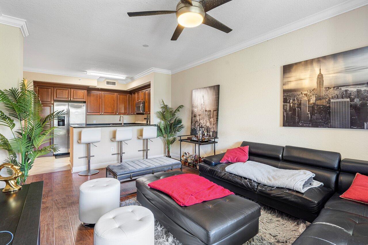 1 Renaissance Way, Unit 416 Boynton Beach, FL 33426 - Photo 5 of 31 a living room with furniture and a wooden floor