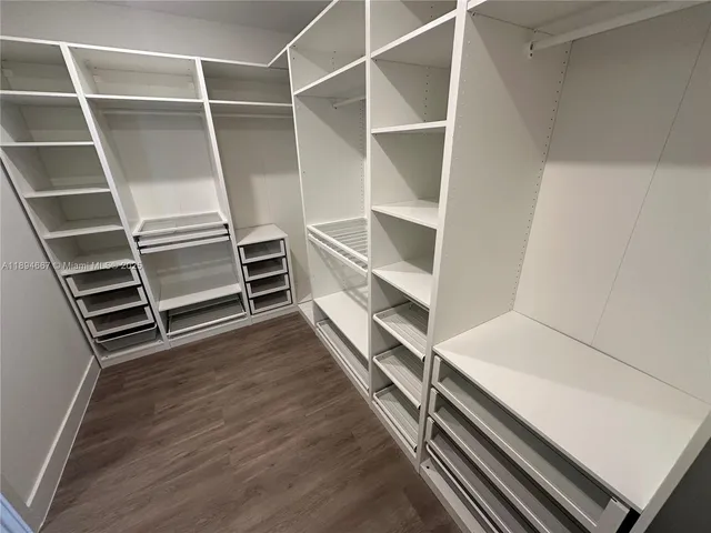 a view of an empty walk in closet