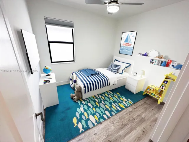 a bedroom with furniture and a window