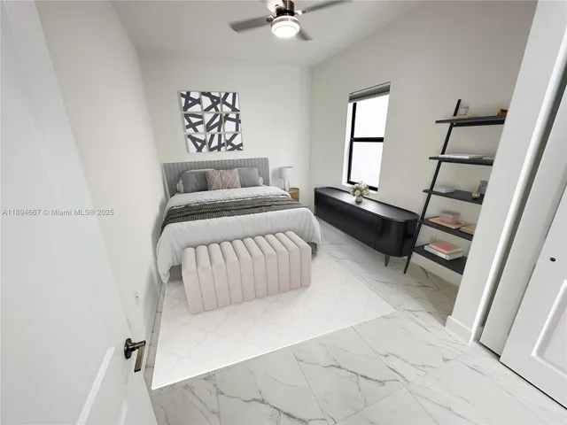 a living room with a bed furniture and a window
