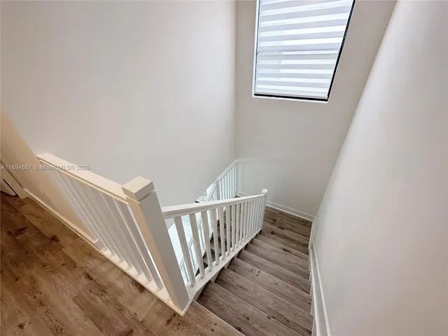 a view of entryway with wooden floor