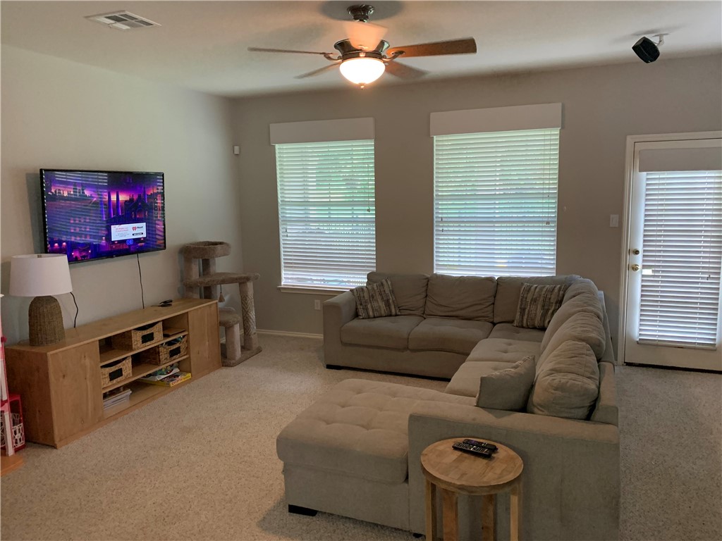 1900 Scofield Ridge Parkway, Unit 1202 Austin, TX 78727 - Photo 6 of 18 Good sized living area with access to back porch/yard